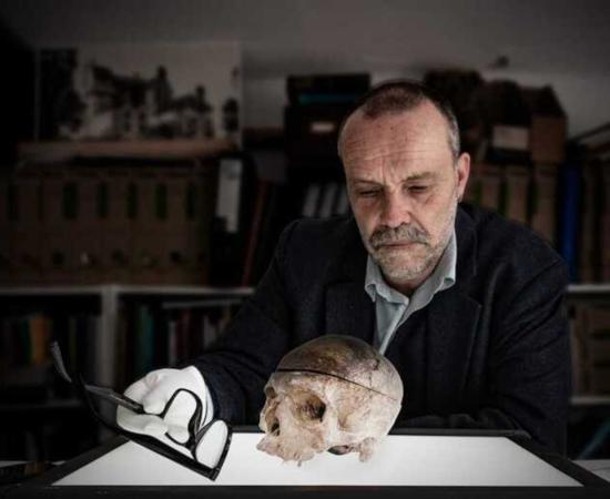 Grantown Museum curator Dan Cottam examines the cursed Comyns skull