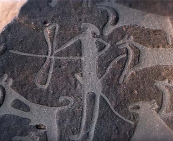 Image showing part of the engraving found in the Arabian Desert with dogs on leashes 