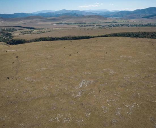 Aerial view of the outer enclosure of the settlement, looking back into Dmanisis Gore from the northwest.