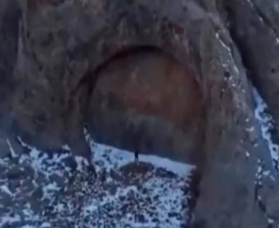 Drone footage showing the massive stone doorway formation in Kazakhstan's Dzungarian Alatau mountains
