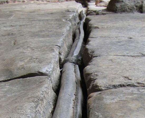 An original Roman lead waterpipe in Bath, England.