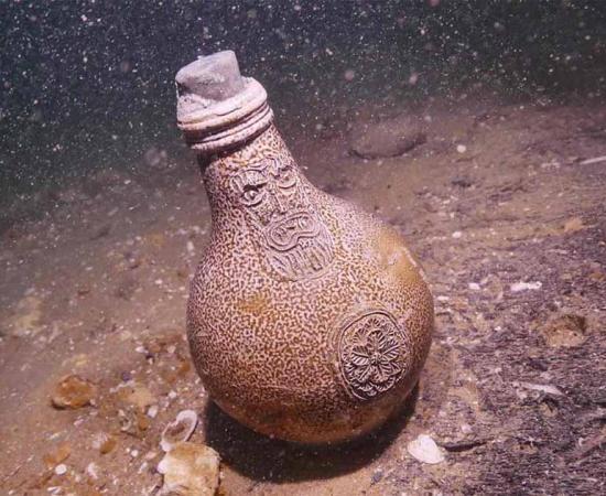 A Bellarmine jug found on the seabed near the wreck of the Dutch warship Klein Hollandia, identified off the coast of Eastbourne, England. Source: © James Clark