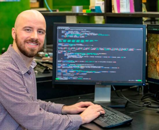 George Long performing genomic data analysis on the mummy where the E. coli was detected.	Source: Georgia Kirkos / McMaster University