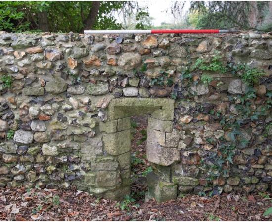The garden ruin of Bosham Manor House, featuring a lancet window on the northern half of the west wall. Archaeologists have discovered evidence of the once home to Harold Godwinson, the last Anglo-Saxon king.