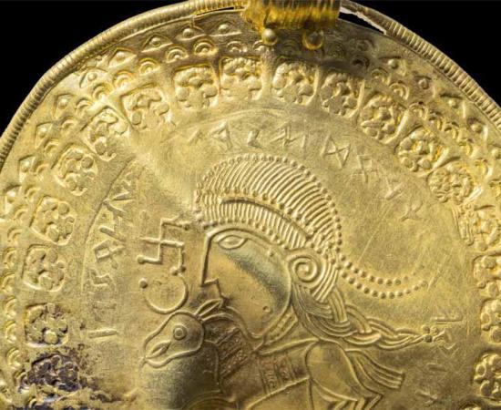 The medallion bearing the earliest known mention of the Norse god Odin.     Source: Arnold Mikkelsen/ Denmark National Museum