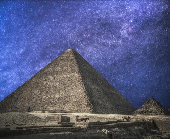 Egypt’s Pyramids of Giza, in the night sky. 	Source: 	Aliaksei / Adobe stock