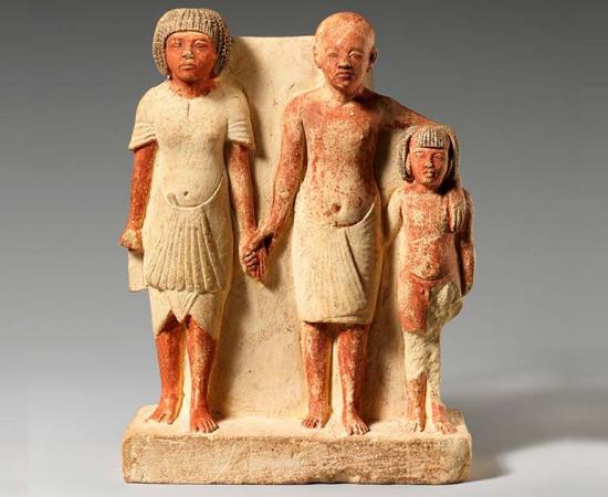 Egyptian statue of two men and a boy that served as a domestic icon. Source: The Metropolitan Museum of Art / Public Domain.