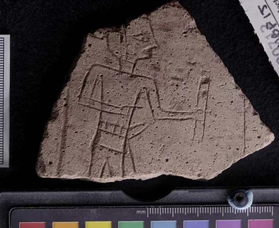 An etched pot sherd with an image of a scribe holding an ink palette. Found near an ancient Egyptian amethyst mine.