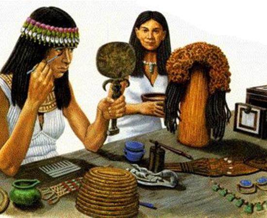 A picture of an Egyptian woman applying kohl to her eyes.