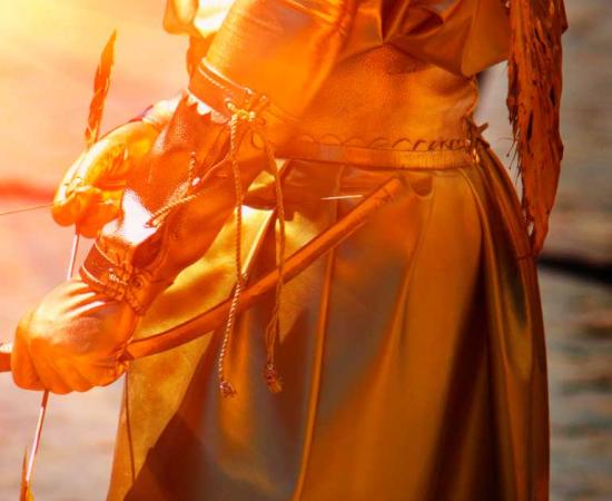 Gold Eros, Greek god of love representation close up on middle body, bow and arrow. Source: zwiebackesser / Adobe Stock