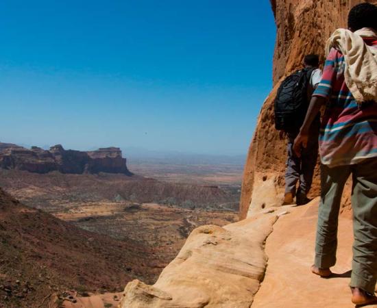 Towards the rock-hewn church of Abuna Yemata Guh in Tigray Ethiopia. Source: Reto Ammann / Adobe Stock.