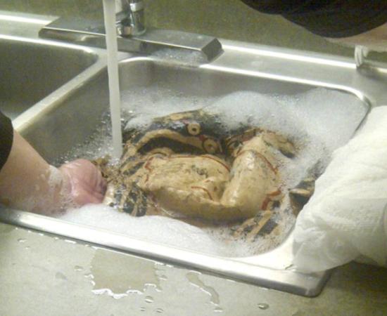 Extracting papyri from a Greco-Roman mummy mask, in hopes that early Biblical texts might be found. 