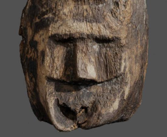 Carved wooden face discovered in Lake Lednica, Poland