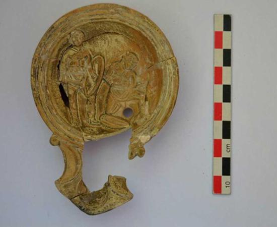 Decorated Hellenistic pot lid found at the site. 