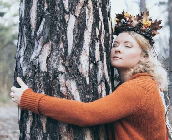 According to folklore and myths, certain Finnish trees hold spirits and deities and hugging them brings people in closer contact with these.  Source: leonovo / Adobe Stock