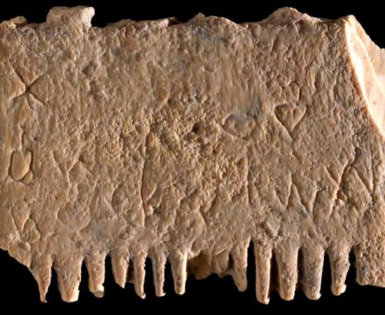 First Canaanite writing scratched onto an ivory comb. Source: Dafna Gazit/Israel Antiquities Authority
