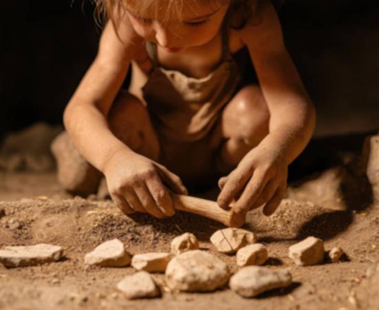 Representative image of Neanderthal child playing with a collection of stones.