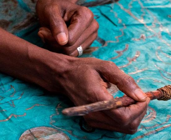 Decorating fabric in Gambia. Source:  s-aznar / Adobe Stock.