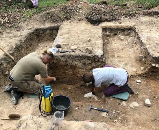 Archaeologists investigating the German burial site.  Source: Antiquity Publications Ltd