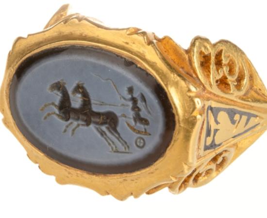The Roman gold finger ring with a dark blue and light grey nicolo engraved gem depicting Victory