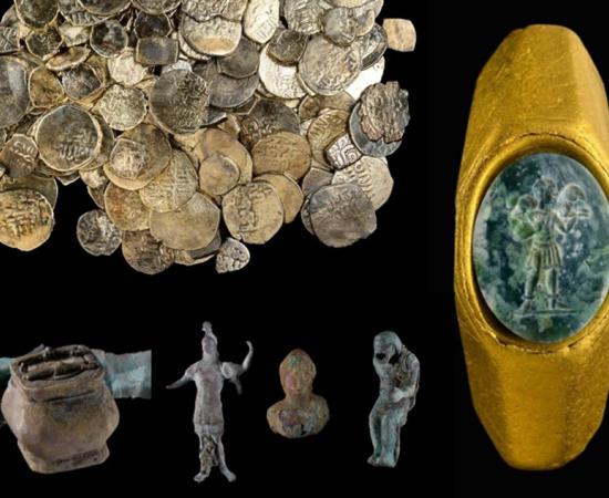 An octagonal gold ring set with a green gemstone and carved with the 'Good Shepherd' figure.		Source:  Dafna Gazit, Israel Antiquities Authority