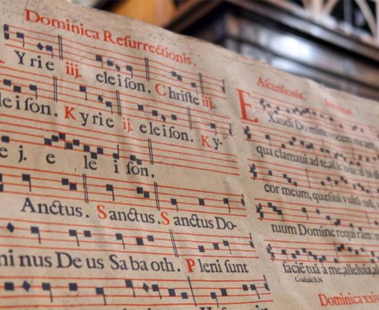 Book of Gregorian chants within a cathedral. Source: Ivan / Adobe Stock