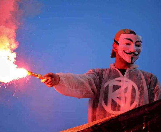 Guy Fawkes masks have become a symbol of anarchy and protest against tyranny, seen here during a protest in Madrid. Source: Daniel López García / CC BY 2.0