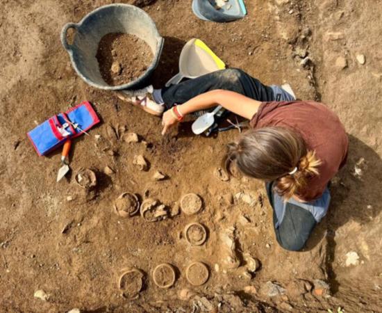 Archaeologist excavating ceramic pots at Hadrian's Villa.