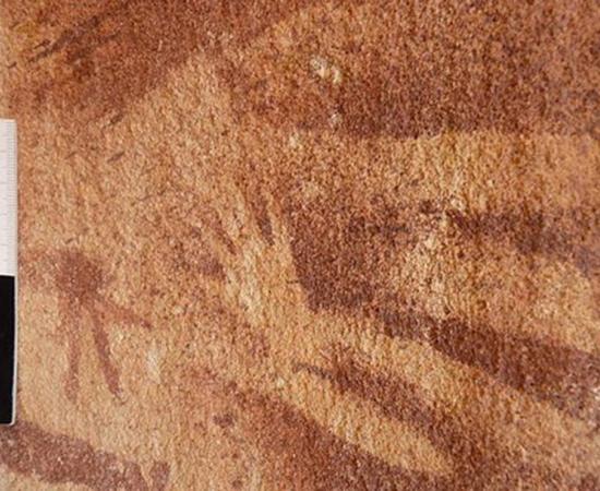 A tiny hand, originally assumed to be of a very young child or infant was stenciled inside the outline of an adult hand on the wall of the Wadi Sura II rock shelter about 8,000 years ago. New research suggests that the prints were actually made by reptiles.