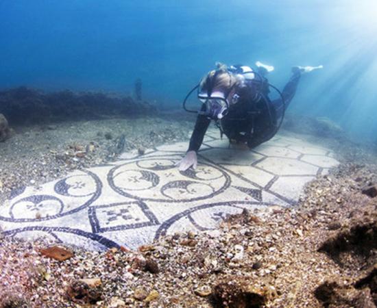 A diver explores the Baiae Underwater Archaeological Site