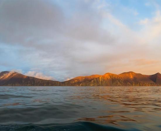 Beautiful panorama with a rainbow over the sea and the coast. The amazing nature of the Arctic. Picturesque northern landscape. Providence Bay, Bering Sea, Pacific Ocean. Chukotka, Far East of Russia   Source: Andrei Stepanov / Adobe Stock