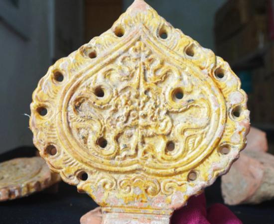 A dragon design on a Bodhi leaf made of terracotta and glazed with gold was discovered at the Ho Dynasty Citadel World Heritage site.