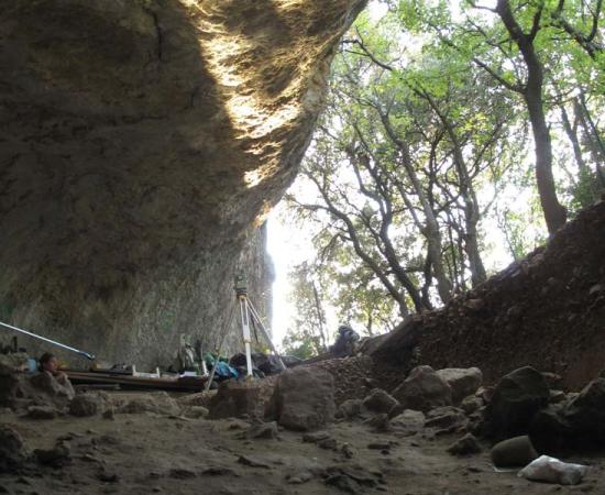 This undated photo provided by Ludovic Slimak shows scientists working at the entrance of the Mandrin cave, near Montelimar, southern France where the oldest modern human remains in Europe were found.	Source: Ludovic Slimak / CNRS)