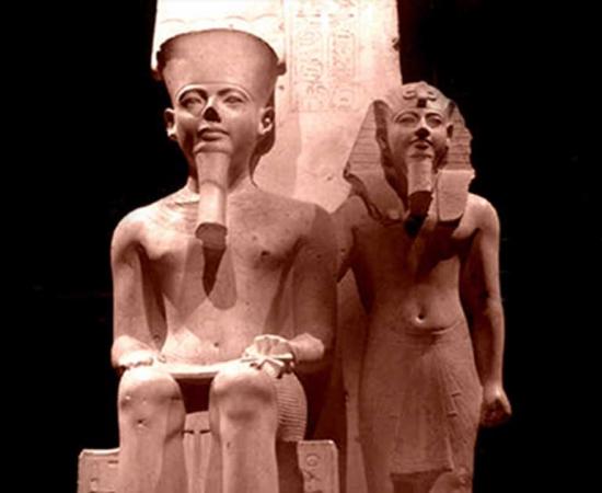 A limestone sculpture from the Temple of Amun in Thebes depicts Horemheb standing beside the state god; design by Anand Balaji 