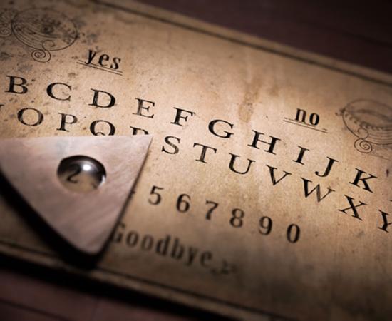 Ouija Board - talking board and planchette used on seances for communicating with the dead. 