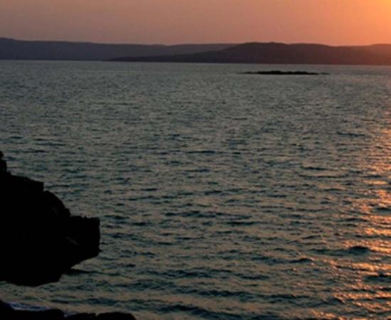 Sunset looking across Port Warrender to the Mitchell Plateau on the Kimberley coast. It is in Wunambal Gaambera country