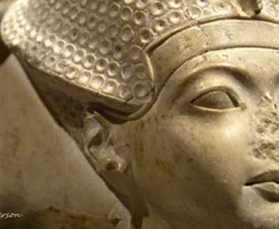 his head of indurated limestone is a fragment from a group statue that represented Amun seated on a throne, and Tutankhamun standing or kneeling in front of him. Metropolitan Museum of Art, New York