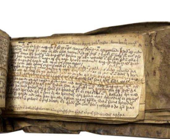 Icelandic literature written in Old Norse, but on recycled parchment where some Latin writing is still legible..