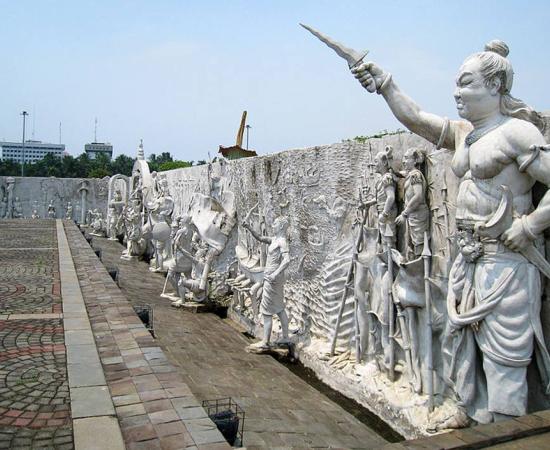 The northeastern corner of an Indonesian national monument. In this section the Majapahit Empire is depicted including Gajah Mada at the nearest right. Jakarta, Indonesia. 