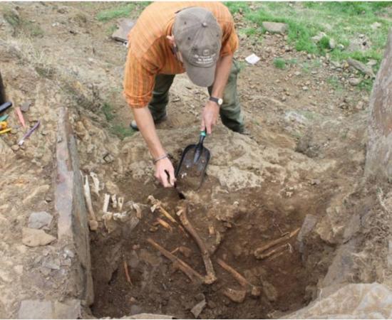 Iron Age grave containing father and son weavers. 