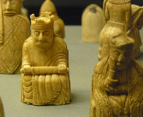Lewis Chessmen king and queen, with rook and knight behind them.