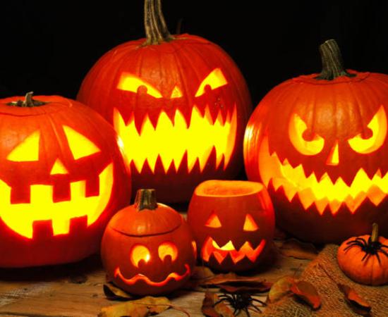 Spooky illuminated pumpkin Jack o Lanterns.  