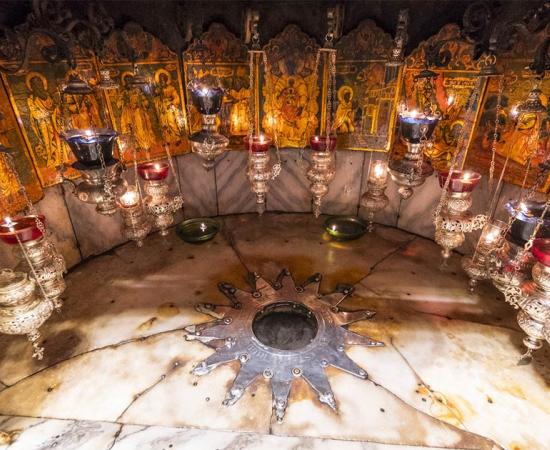 A silver star marks the traditional site Jesus' birthplace in a grotto underneath Bethlehem's Church of the Nativity.       