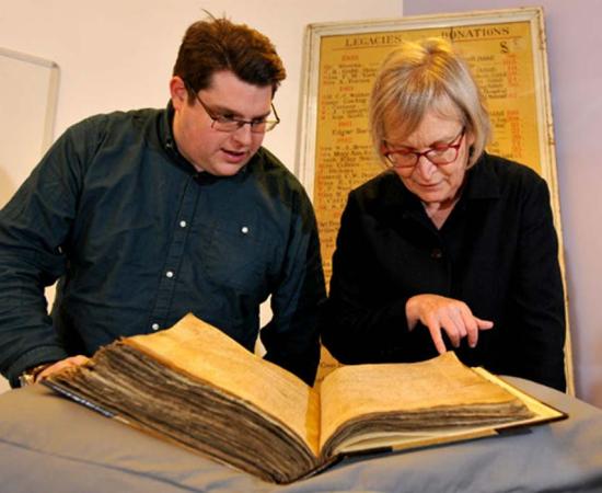 Gary Brannan and Sarah Rees Jones examine the note regarding Joan of Leeds in one of the archbishops’ registers. 