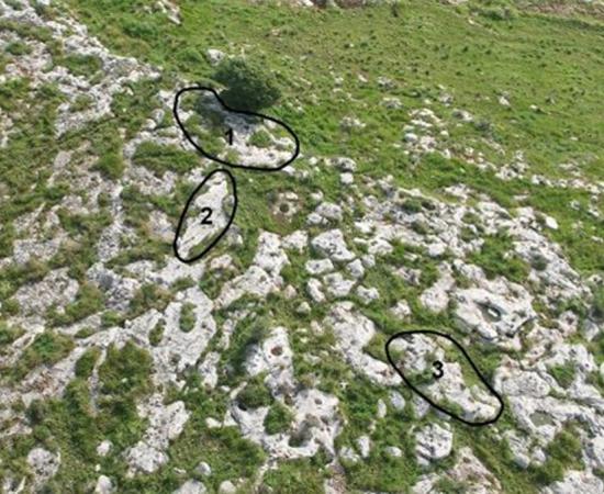 Aerial view of Kaizer Hilltop with three sampled rock surfaces marked in black circles