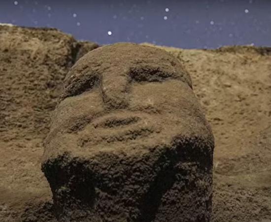 A human head in an ancient wall at the Karahantepe site in Turkey.  Source: Ancient Architects / YouTube screenshot