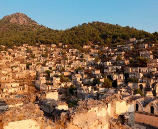 The abandoned and earthquake-damaged ruins of Kayakoy have become a tourist attraction. Source: Nullplus / Adobe Stock 