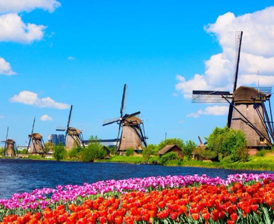 The Kinderdijk Windmills and surrounding waterways during spring, The Netherlands Source:  Nikolay N. Antonov / Adobe Stock