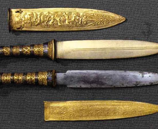 These two daggers were found in King Tutankhamun's burial wrappings: the lower one is King Tut’s dagger made from iron from a meteorite, and likely foreign made according to the latest research study. 		Source: Ancient Egypt