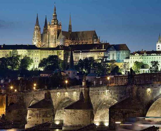 Night view of the castle and Charles Bridge, Prague, Czech Republic. Prague, over time, became the definitive center of the growing Kingdom of Bohemia.	